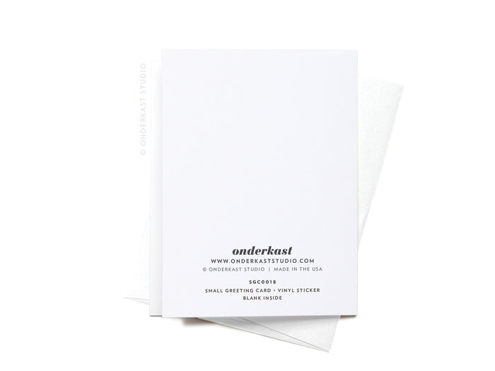 The Greetings From Texas Sticker Greeting Card by Onderkast Studio is a white card made from quality white cardstock, with black product details on the back. It’s shown on a white envelope against a white background.