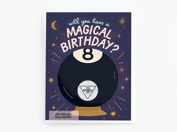 The Magic 8-Ball Birthday Scratch-Off Greeting Card by Onderkast Studio features a playful 8-Ball and the question Will you have a magical birthday? with stars, a crescent moon, and the answer It is decidedly so! on a purple background.